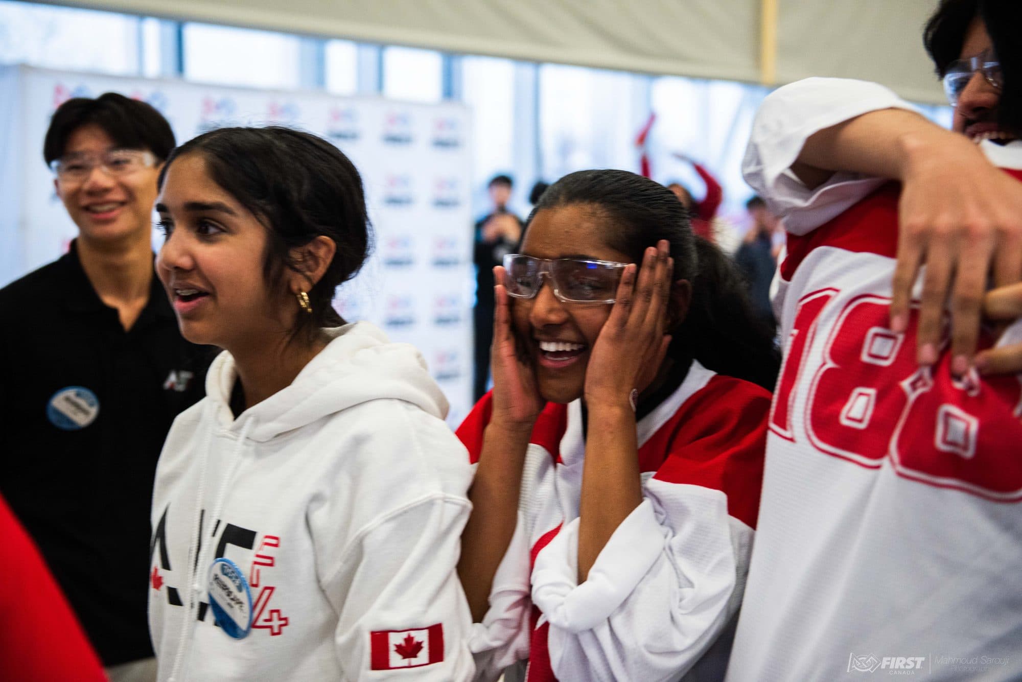 Team members cheering in the stands